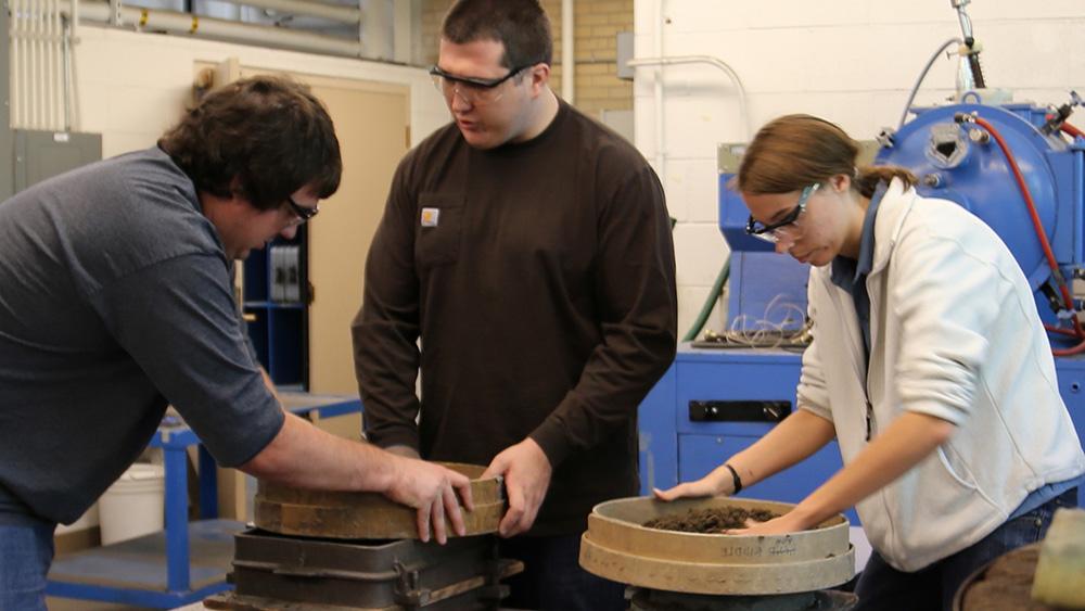students working with machinery
